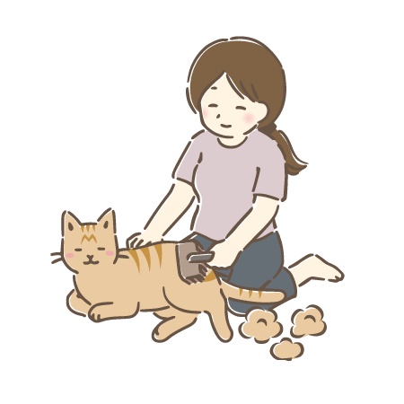 猫の毛をブラッシングする女性